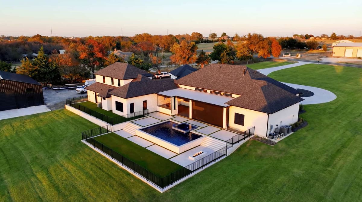Luxury infinity-edge pool with modern home — built by Prestige Pool & Patio